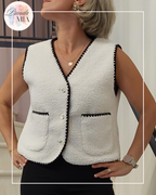 Sleeveless vest with black trim