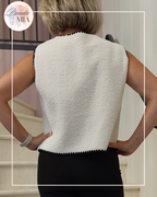 Sleeveless vest with black trim